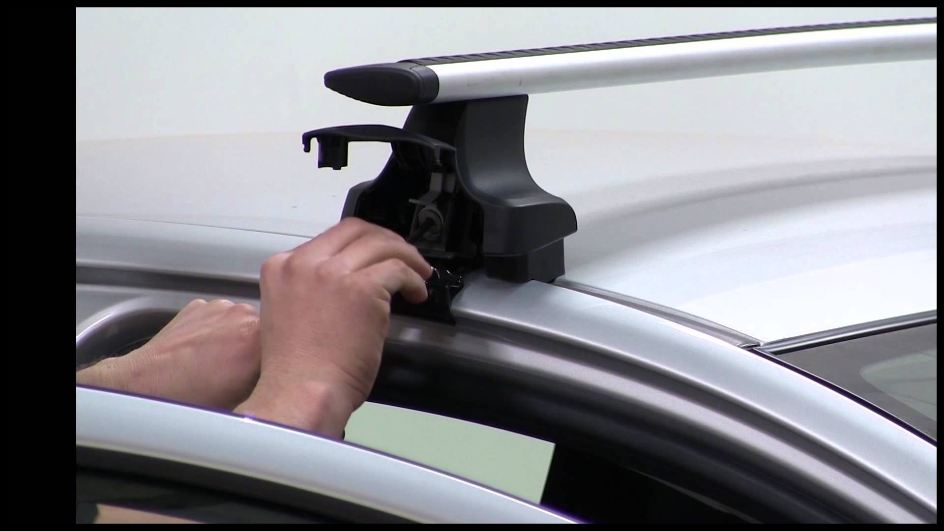 Installation of a Thule AeroBlade Traverse Roof Rack on a 2012 Toyota Yaris etrailer